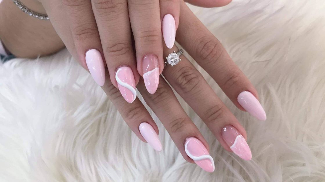 Acrylic nails or fake nails designed with pink and white