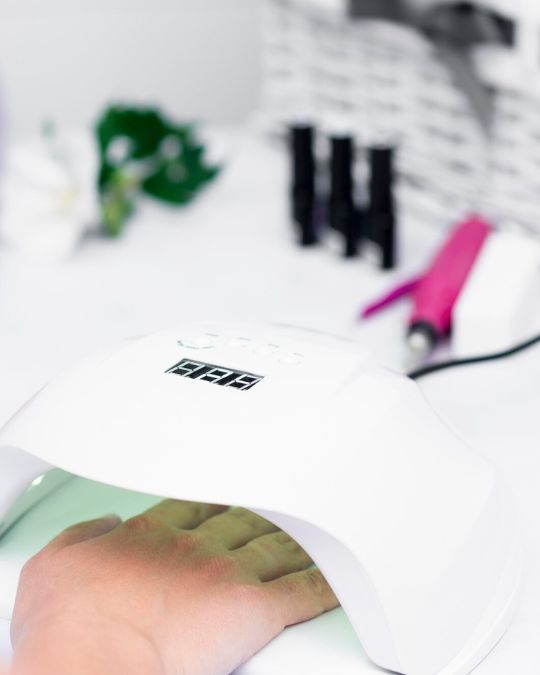 Gel Manicure with Application of base coat with UVLED curing