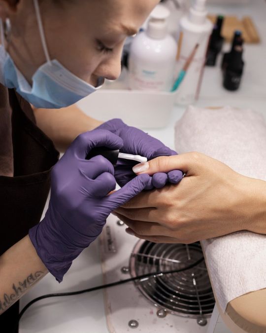 nail tech doing manicure services