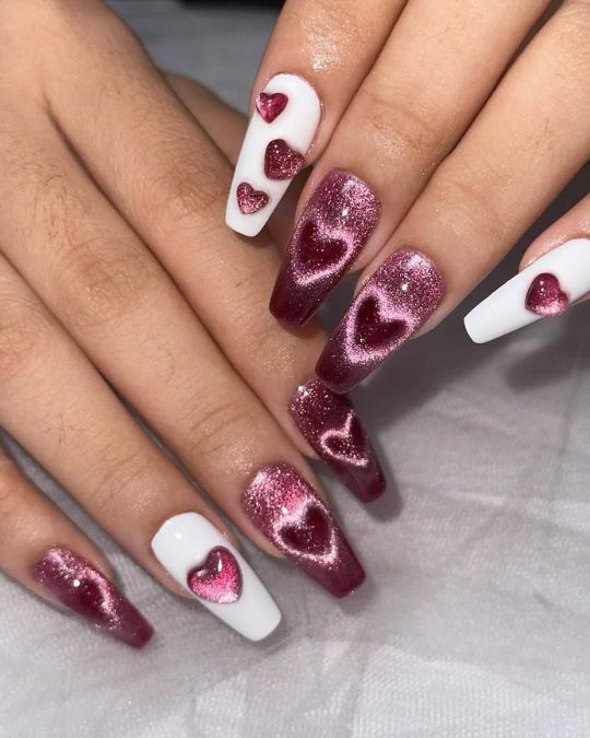 coffin-shaped nails feature a romantic mix of burgundy glitter and white