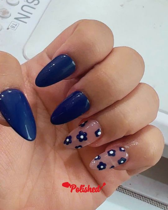 Almond nails with deep blue and flower stickers