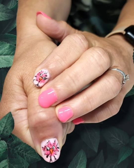 short natural round nails with hand drawn bird face