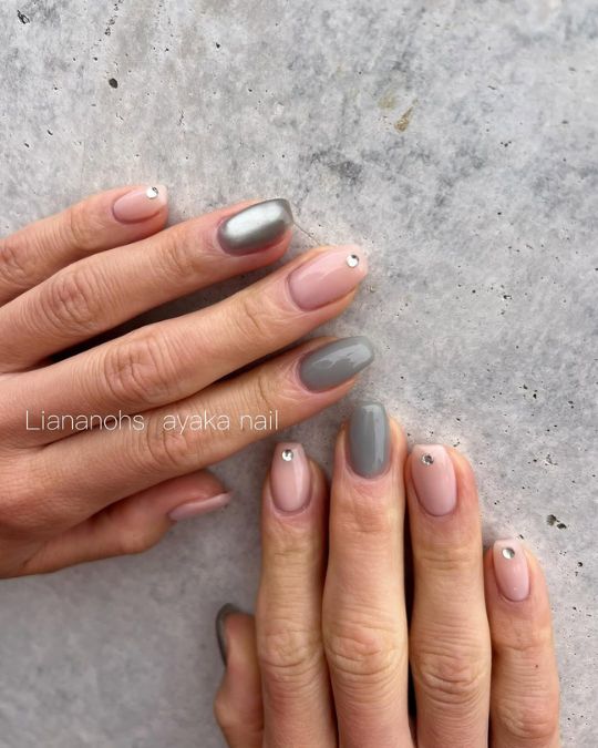Soft pink base and steel gray squoval nails create simple look