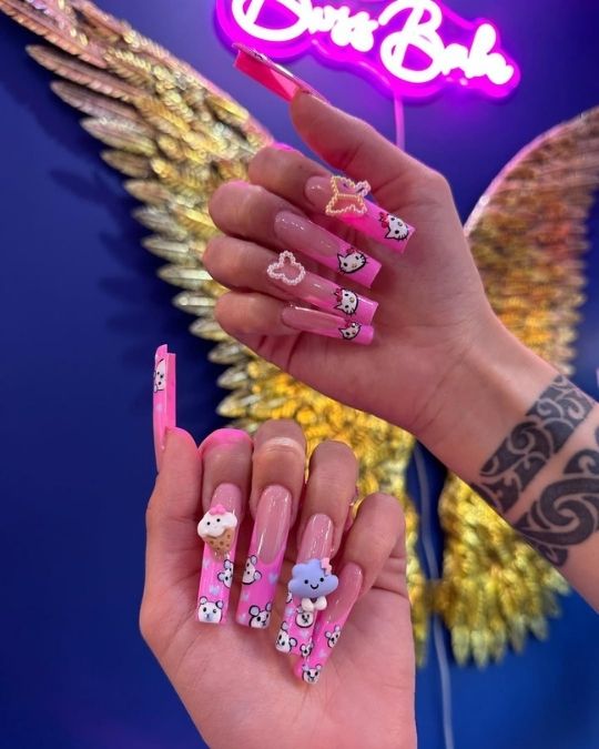 Hello Kitty faces, 3D ice cream and cloud charms, and sparkling butterfly accent on long square nails