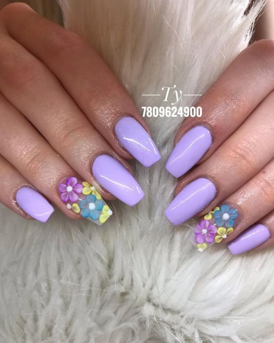 Lavender coffin nails with colorful 3D flowers on accent tips.
