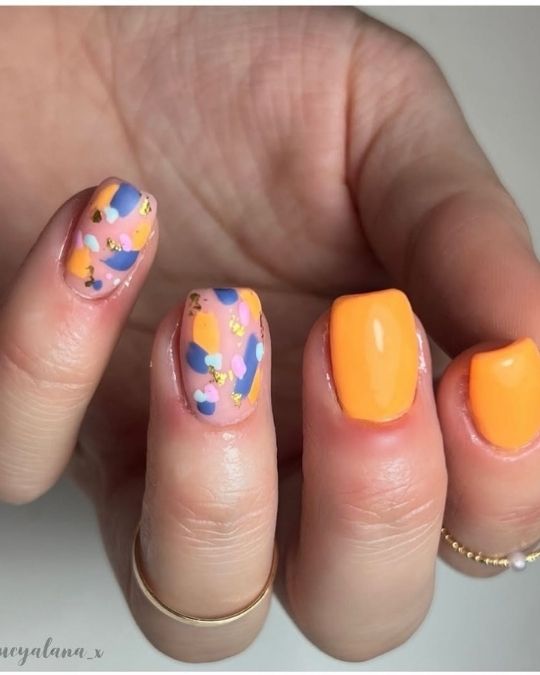 short squoval nails with range and playful abstract patterns