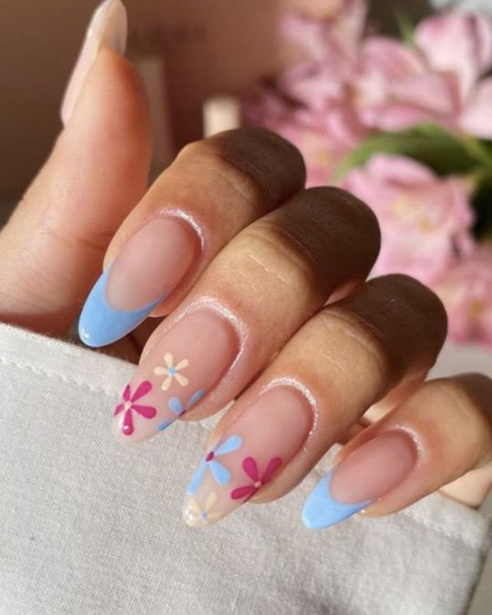 Long almond nails french tips with pastel blue and hand drawing flowers
