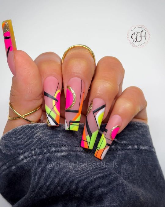 long matte coffin nails with geometric patterns and vibrant colors