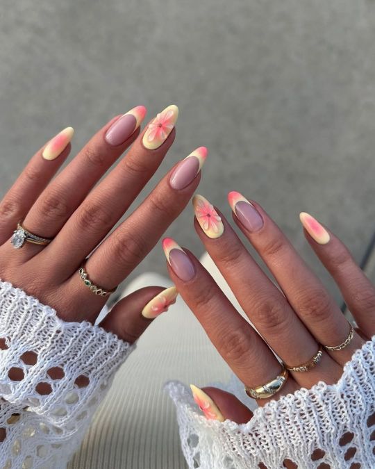 Almond nails pink-yellow ombre and delicate flower and french tip