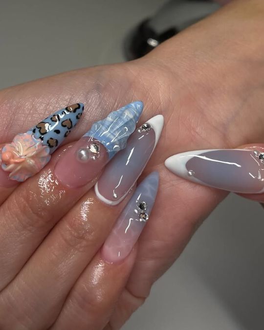 blue marble, peach florals, and leopard print on long almond nails