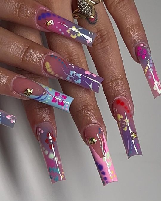 long square nails mix of flowers, butterflies, and golden accents on French manicure