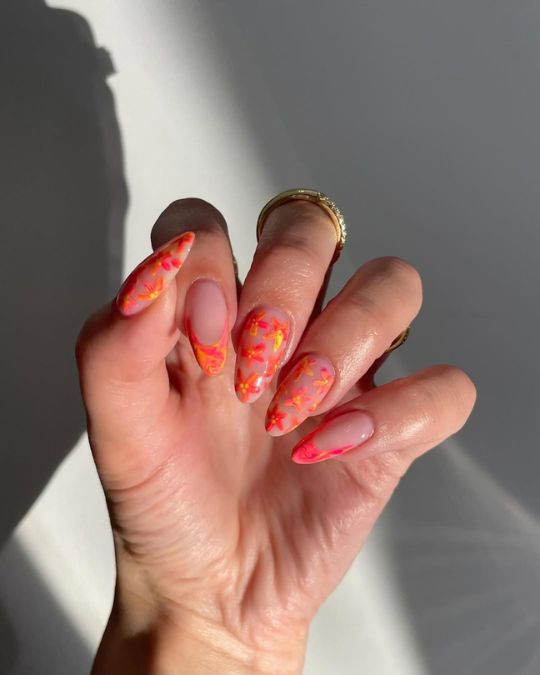 almond mismatched nails with french tips and neon flowers