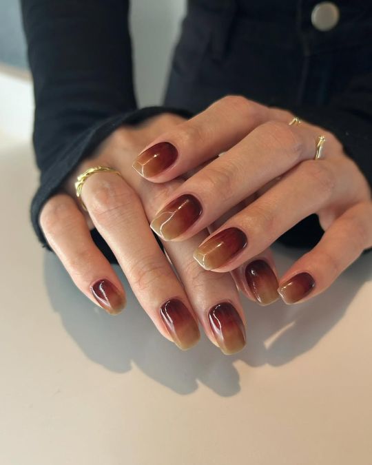 medium length squoval nails with mahogany to warm honey tones