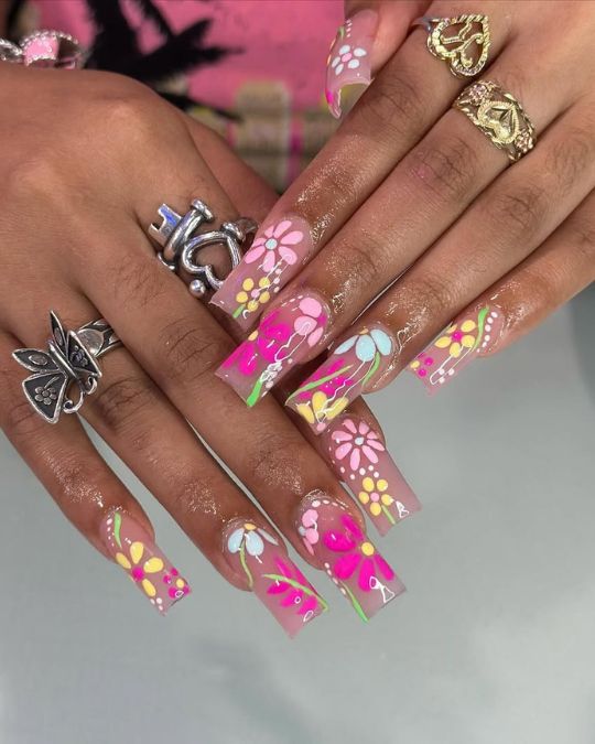 Pink and yellow flowers on sheer base long square nails