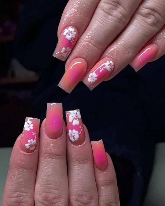 Medium coffin nails with pink aura effect and white hibiscus flowers