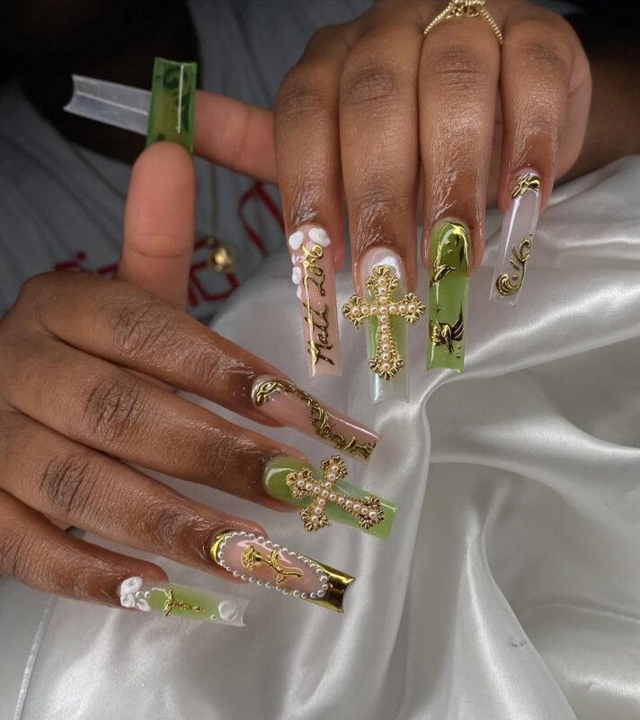 Long, almond-shaped, gold-accented, pearl-adorned, cross-embellished, green-tinted, intricate, elegant, religious-themed, luxurious.