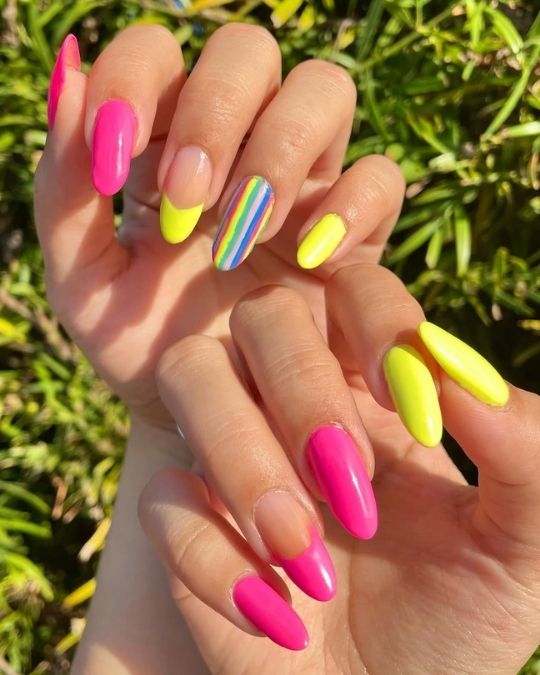 almond nails with neon pink, green and rainbow french tip
