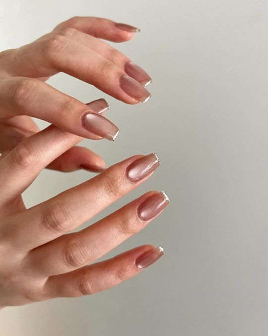 Long nails with magnetic and tiny silver dots