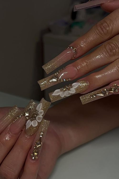 cayxacrylics Golden Luxury Bloom Golden luxury bloom prom nails with long square shape.